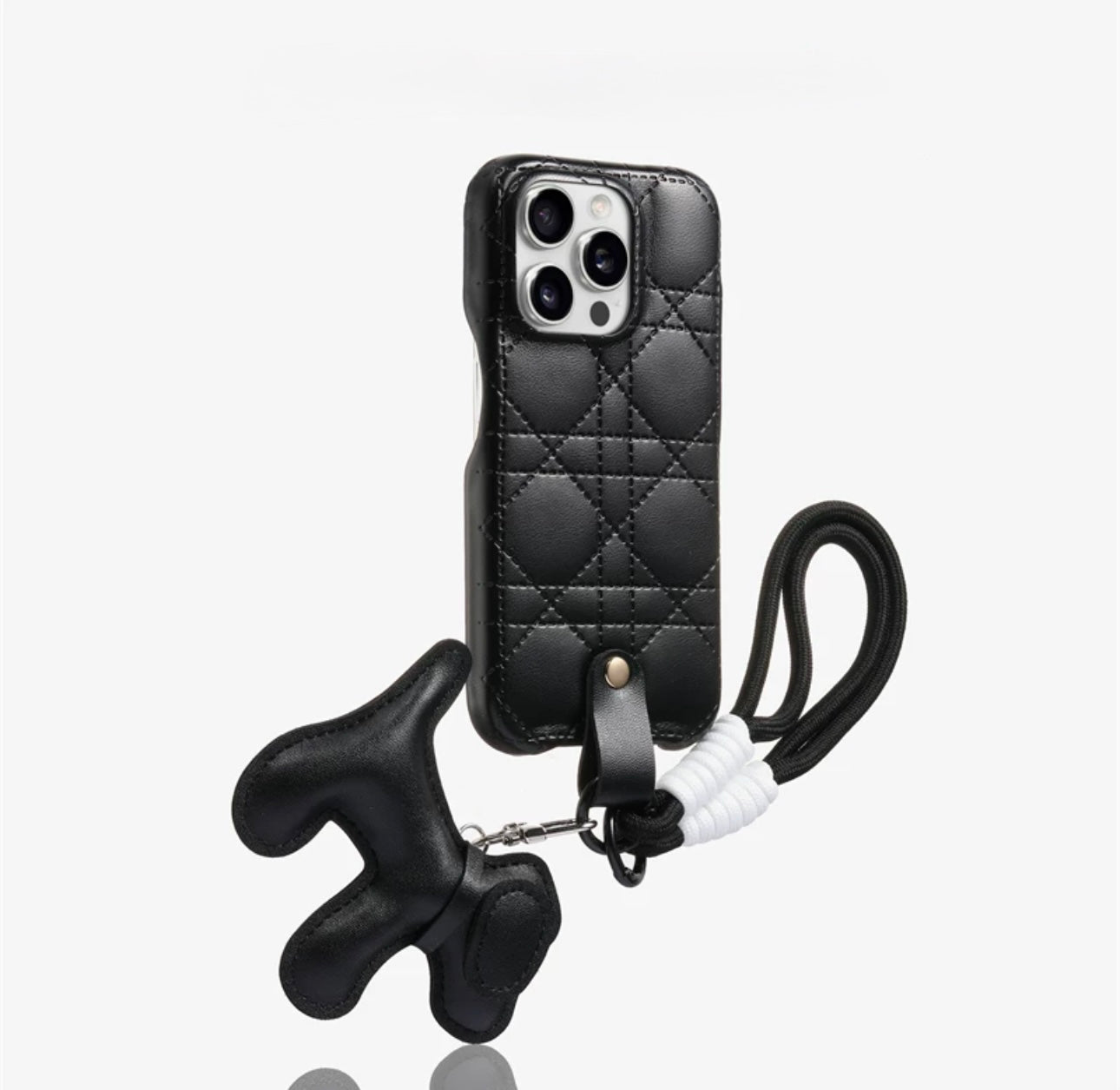 Quilted phone case with dog-shaped charm