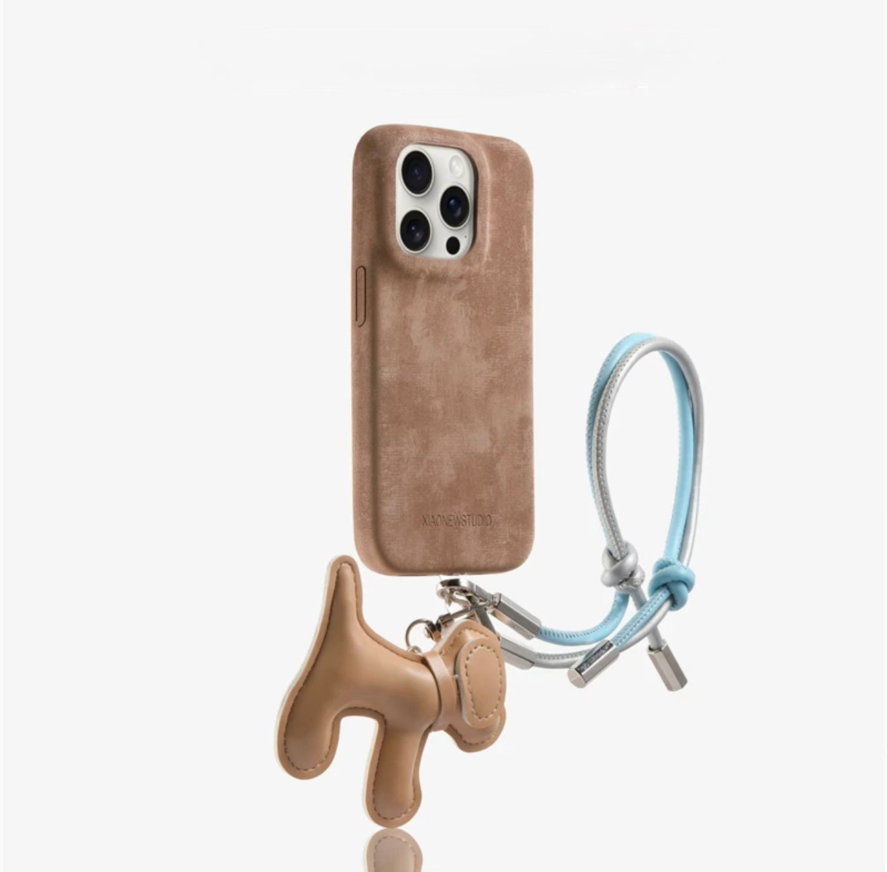 Suede phone case with dog-shaped charm